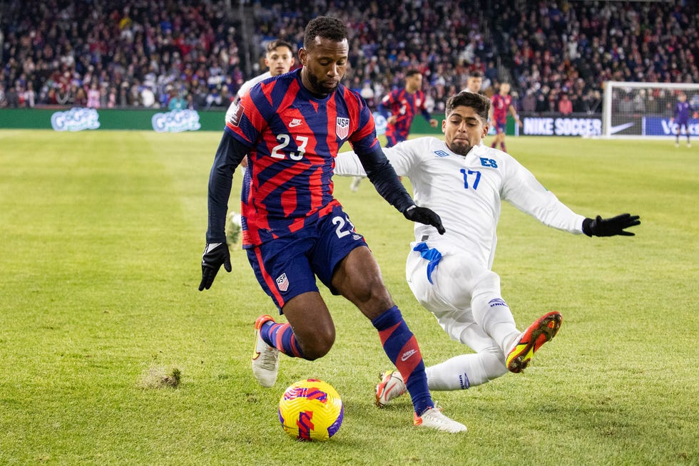 Jan 27, 2022; Columbus, Ohio, USA; United States midfielder Kellyn Acosta (23) dribbles the ball while El Salvador forward Jairo Henriquez (17) defends during a CONCACAF FIFA World Cup Qualifier soccer match at Lower.com Field.