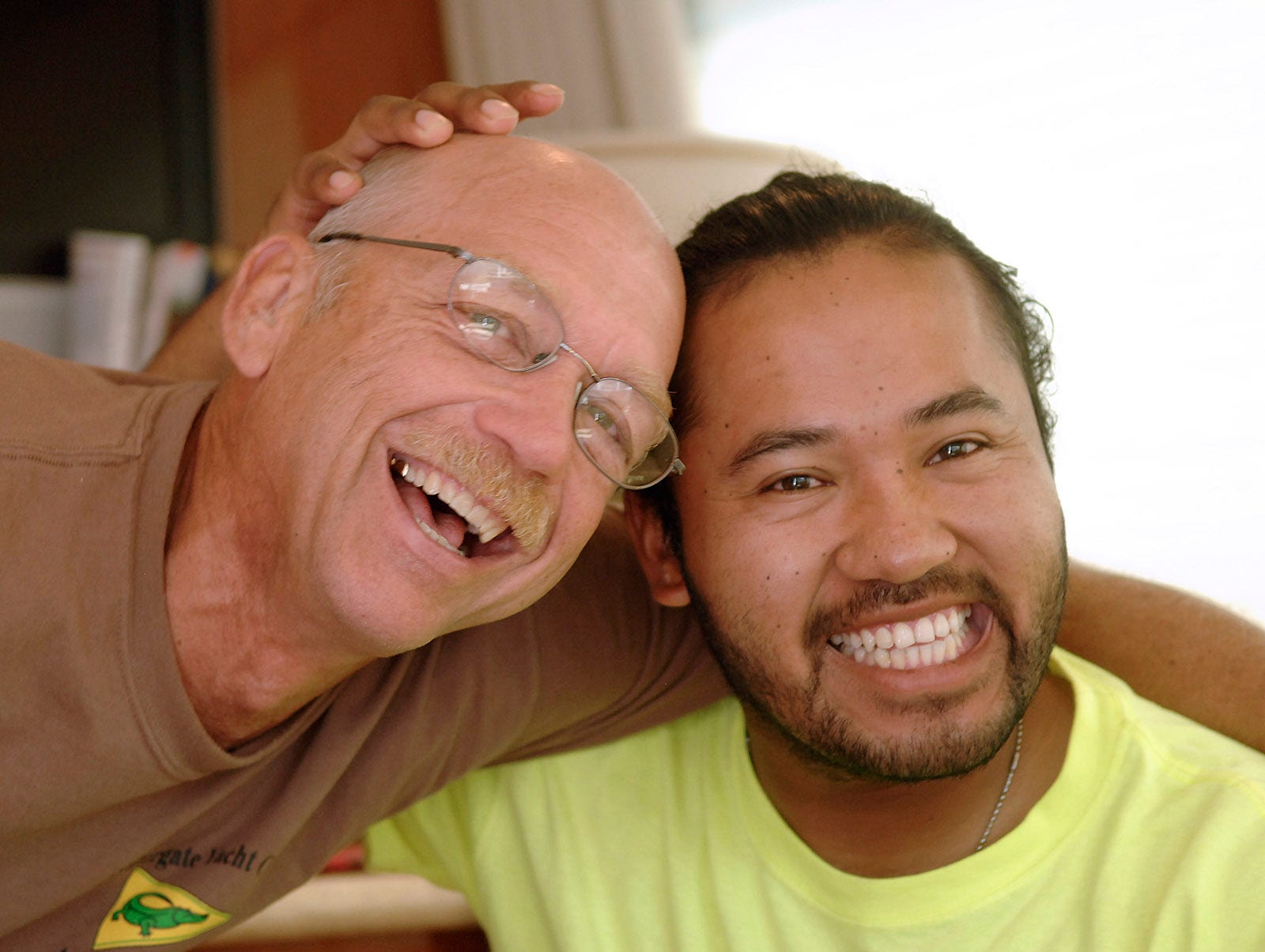 Don Manley, left, and his adopted son Hector kid around during the "Paddling for a Purpose" trip on the Mississippi River in 2012.   Manley was convicted in 2022 of being a sexual predator and admitted to 20 charges of molesting children. PROVIDED / ROY SYKES JOURNAL / St. Louis Post-Dispatch