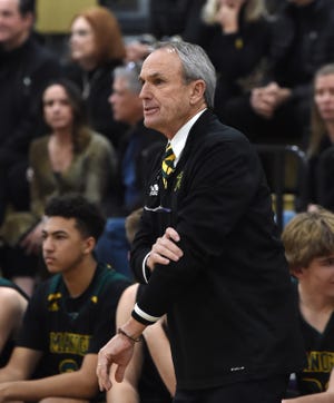 Bishop Manogue boys basketball coach W.K. Ballinger watches from the sideline during a recent game against Spanish Springs in Jan. 27, 2022.