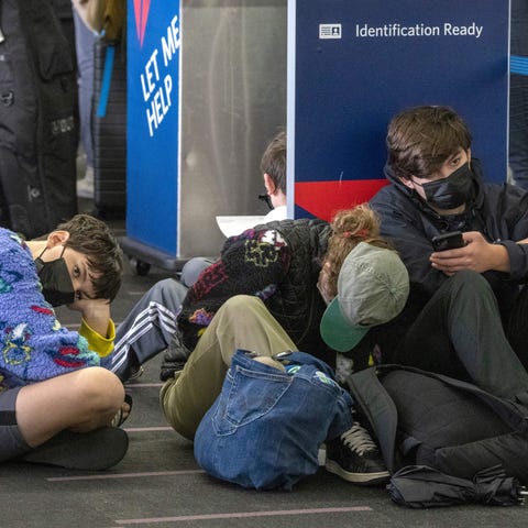 Travelers wait at Los Angeles International Airpor