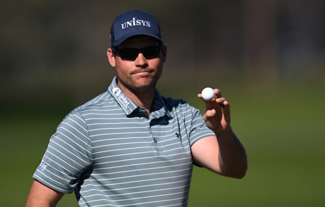 Adam Schenk acknowledges the crowd after competing his second round of the Farmers Insurance Open on Thursday.