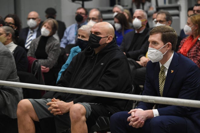 U.S. Rep. Conor Lamb, right, sits next to Lt. Gov. John Fetterman, left, wait for President Joe Biden to speak at an event in January in Pittsburgh. Both men are seeking the Democratic nomination for U.S. Senate.