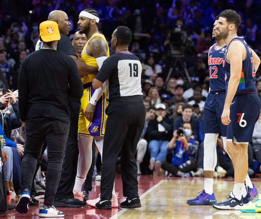 Los Angeles Lakers forward Carmelo Anthony confronts a fan during the fourth quarter of the game against the Philadelphia 76ers.