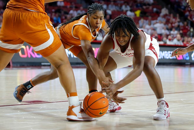 Oklahoma guard Madi Williams and Texas' Aliyah Matharu fight for the ball during their Jan. 29 game in Norman, Okla. The Sooners won that game and are currently tied with Iowa State atop the Big 12 standings.