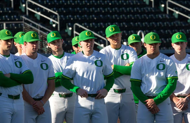 The Oregon baseball listen to the coaching staff on their first official practice day of the 2022 season.