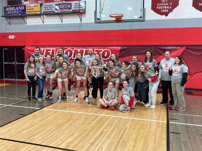 Loudonville's girls basketball team poses for a picture after beating Mansfield Christian Saturday at Loudonville High School. The Redbirds finished Mid-Buckeye Conference play unbeaten for the second consecutive season and fourth time in the past five years.