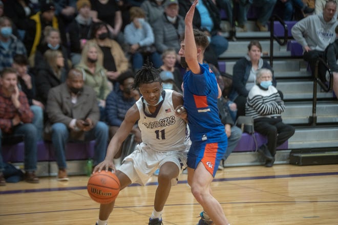 Lutheran's Vontez Dent dribbles against Genoa-Kingston on Saturday, January 29, 2022, at Rockford Lutheran High School in Rockford. Dent and the Crusaders won 74-53.
