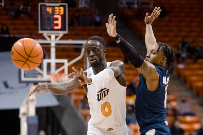 FIU attempts to block UTEP's Souley Boum (00) at a men's basketball game Saturday, Jan. 29, 2022, at the Don Haskins Center in El Paso, Texas.