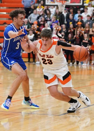 Tecumseh's Ryder Zajac drives the ball while Adrian's Joe Francis defends during Friday's game against the Maples.
