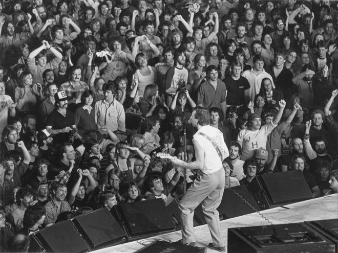 The Centrum crowd responds to Pete Townshend of the Who during a show on Dec 11, 1982.