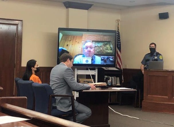 Defendant Theary Lim, left, was seen in Montgomery County courthouse represented by defense attorney Chase Smith, right, while listening to language interpreter Vannara S. Lim via Zoom Monday morning Jan. 31, 2022