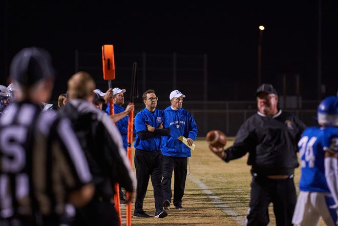 Mesquite head football coach Scott Hare watches his team from the sidelines at Casa Grande Union High School in Casa Grande, Ariz. on Friday, Dec. 3, 2021.