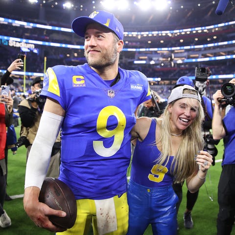 Matthew Stafford and wife Kelly react after the Ra