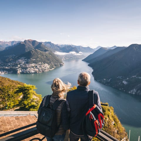 They relax at viewpoint and look off to distant sc