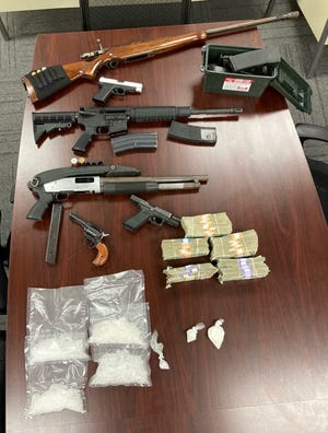 A Muncie-Delaware County Drug Task Force search warrant served Monday at a home on East 14th Street resulted in seizure of two pounds of meth, 63.9 grams of fentanyl, six guns and drug paraphernalia.