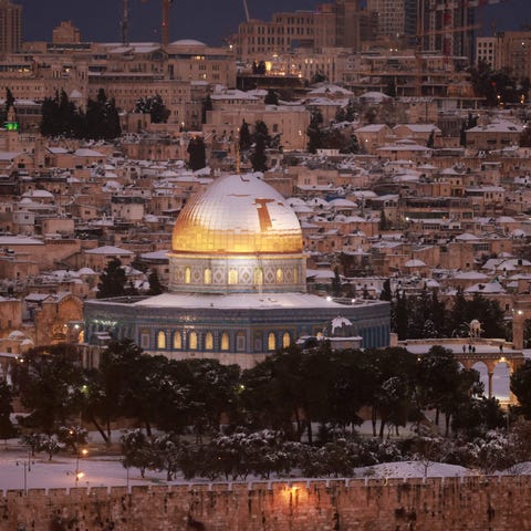 Snow covers the Dome of the Rock at the Al-Aqsa Mo