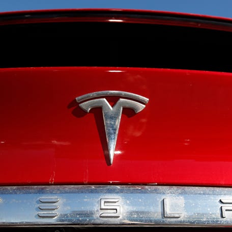 In this Feb. 2, 2020 file photo, the company logo sits on an unsold 2020 Model X at a Tesla dealership in Littleton, Colo.