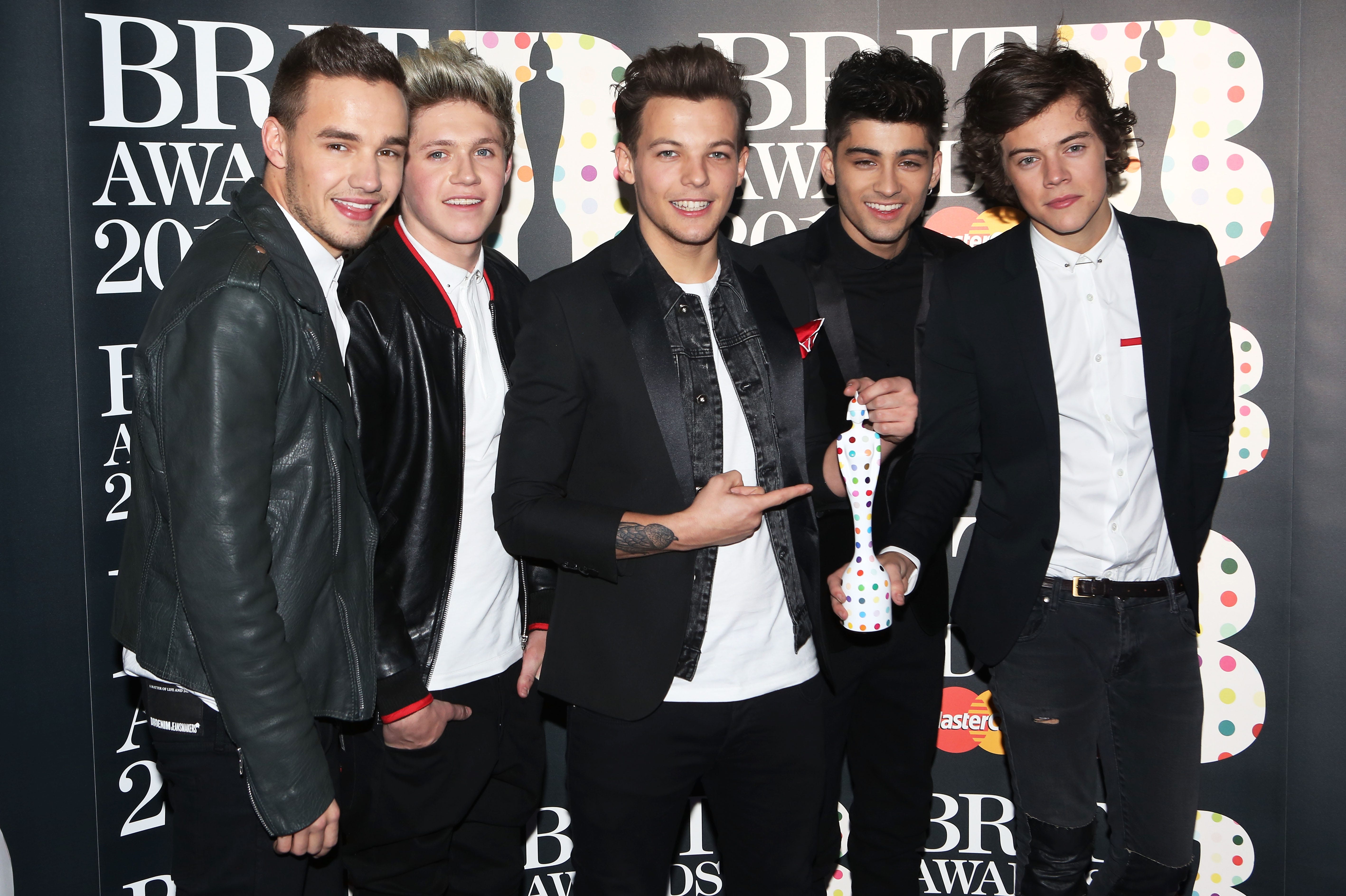 (Left to right) Liam Payne, Niall Horan, Louis Tomlinson, Zayn Malik and Harry Styles of One Direction pose with their Brits Global Success Award in the press room at the Brit Awards 2013 on Feb. 20, 2013, in London, England.
