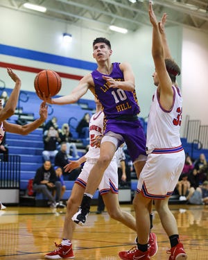 Liberty Hill's Anthony Sierras glides to score in the second half against Leander in District 25-5A action Feb. 2 at Leander High School. Liberty Hill held off a furious fourth-quarter rally by Leander to take the win, 60-52.