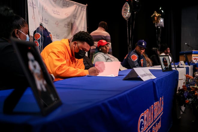 Cedar Shoals football player Adorian Favors signs to play football at the University of Tennessee Chattanooga during National Signing Day at Cedar Shoals High School in Athens, Ga., on Feb. 2, 2022. (Photo by Chamberlain Smith for Athens Banner-Herald)