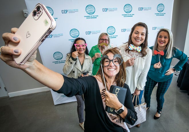 Real estate broker Lina Piedrahita, center, takes a selfie with her friends Gloria Zapata, left, Christie Carey, second from left, Mona Strausser, second from right and Stephanie Burns, right.  The picture was taken at the annual luncheon for the Ocala Metro Chamber & Economic Partnership (CEP).