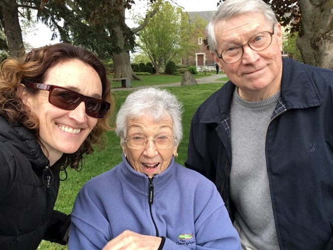 Amy Craig, left, with her parents Barbara and Jack Craig, of Milton. Amy, an occupational therapist, has been using new virtual reality headsets with them.