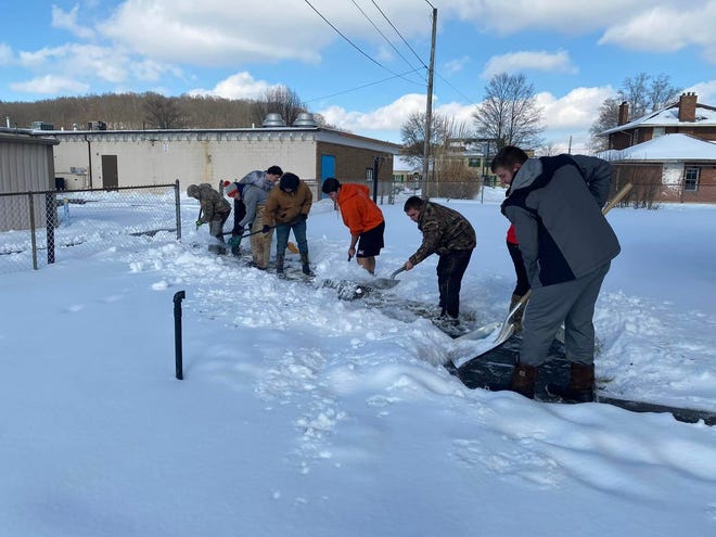 Dirk Gadd, assistant principal at Newcomerstown High School and varsity football coach, led members of the football team out shoveling sidewalks in the village recently. Members of the Newcomerstown football team shoveled the sidewalks and steps for around 30 homes in the community. One village resident commented: “This community service is an example of selflessness which is one of the team's core values. Great job Trojans!” Another resident added the name of Greg Mason on North Bridge Street for a “Good Neighbor” mention, saying Mason uses his snowblower every winter to clear his neighbor's sidewalks and driveways. “I have a very LONG driveway which would  be backbreaking for me to clear. He always clears it for me. I think he's an unsung hero!”