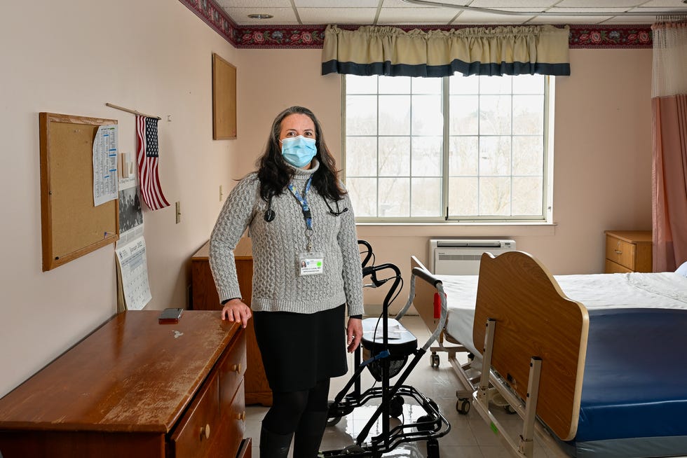 Dr. Larissa Lucas poses for a photo inside one of the resident rooms at Rosewood Nursing and Rehabilitation Center in Peabody, MA on Tuesday, Feb. 1, 2022.