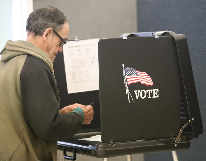 Happy Valley resident John Uberuaga, 79, gets ready to vote at the Happy Valley Community Church polling place during the Shasta County Supervisor District 2 Recall Election on Tuesday, Feb. 1, 2022.
