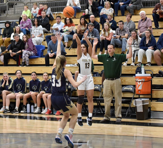 Enid Vaifanua fires away on a three-point attempt early in the first quarter. Vaifanua scored the first seven points for Desert Hills and finished with a game-high 16 points.