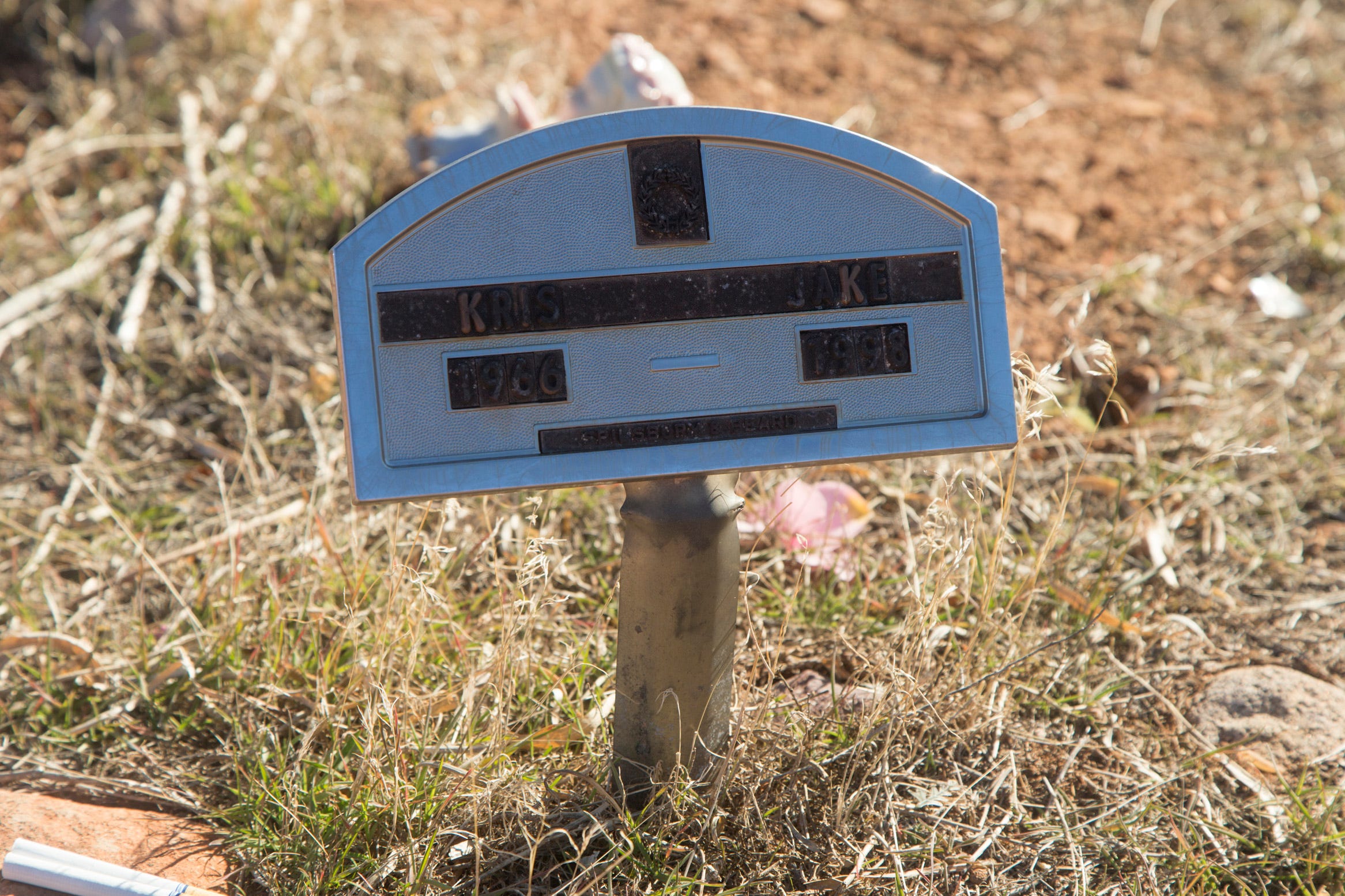 Tamra Borchardt-Slayton and Mike Slayton, family members of victim Kris Jake, visit her gravesite at the Shivwits Cemetery Friday, Jan. 28, 2022.