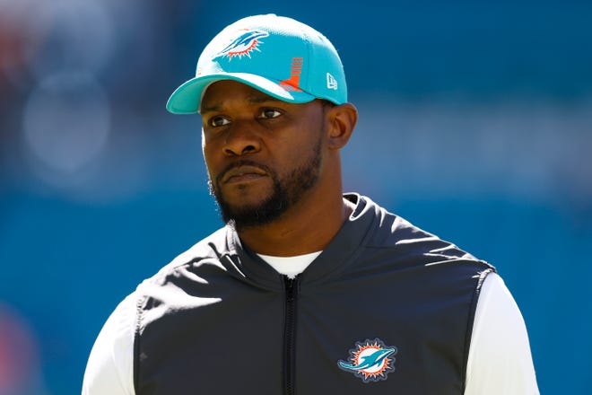 Brian Flores says race played role in firing; Dolphins deny accusation