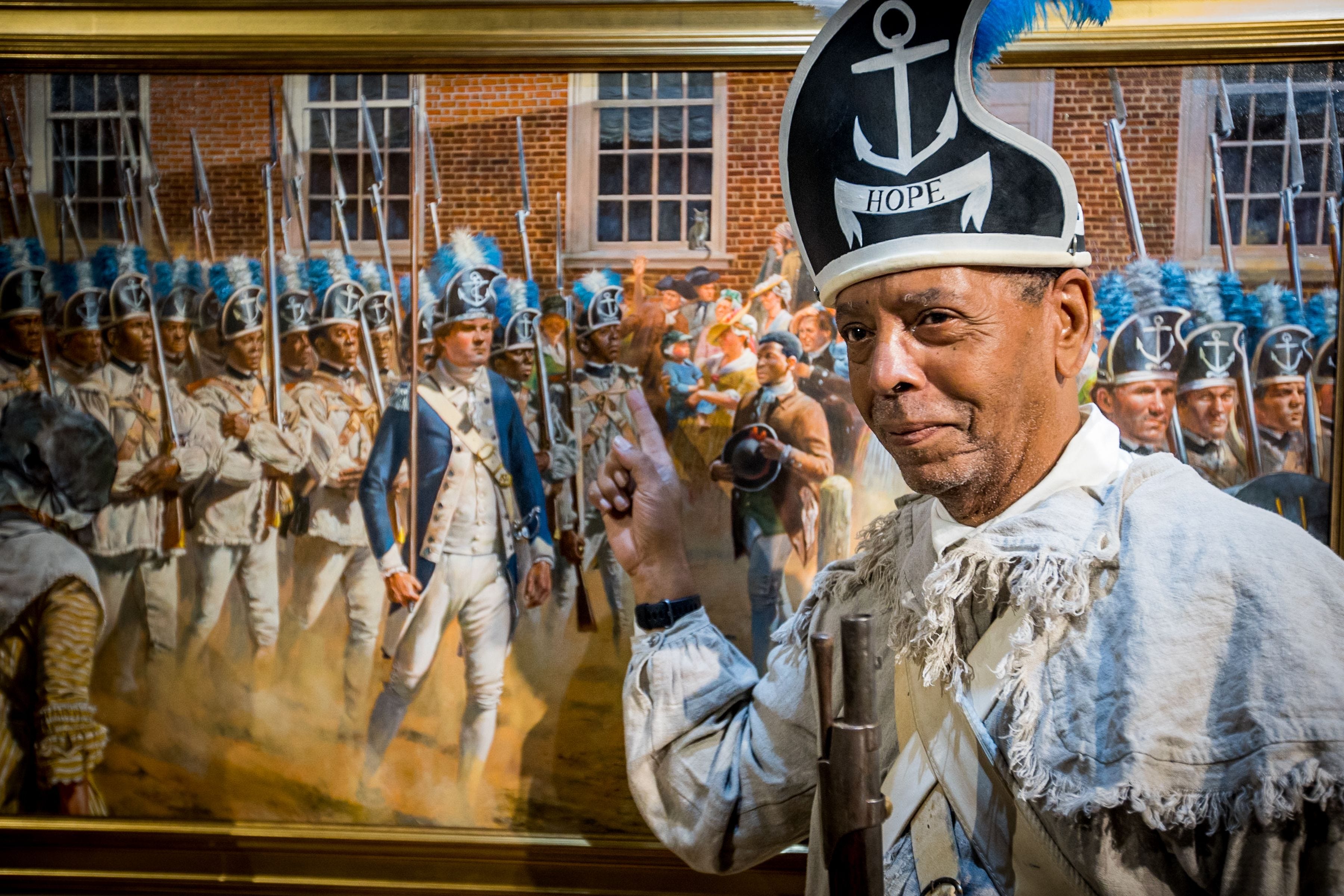 Trenton Historical Society board member Algernon Ward points to himself in painter Don Troiani's painting "Brave men as ever fought." Abolitionist James Forten used those words to describe Black and Native American troops he saw marching past what is now called Independence Hall, in Philadelphia, Sept. 2, 1781