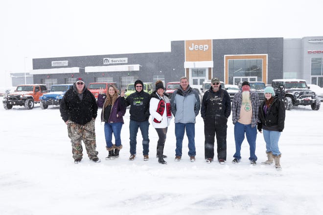 Members of the Jeepin’ Heathens Jeep Club pose for a photo in front of their Jeeps, Thursday, Feb. 3, 2022 in Lafayette.