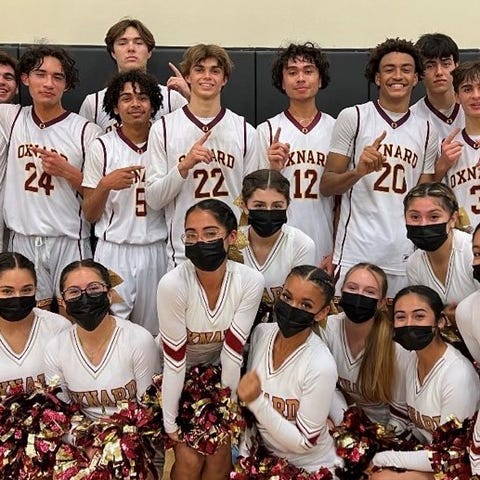 The Oxnard High boys basketball team pose with the