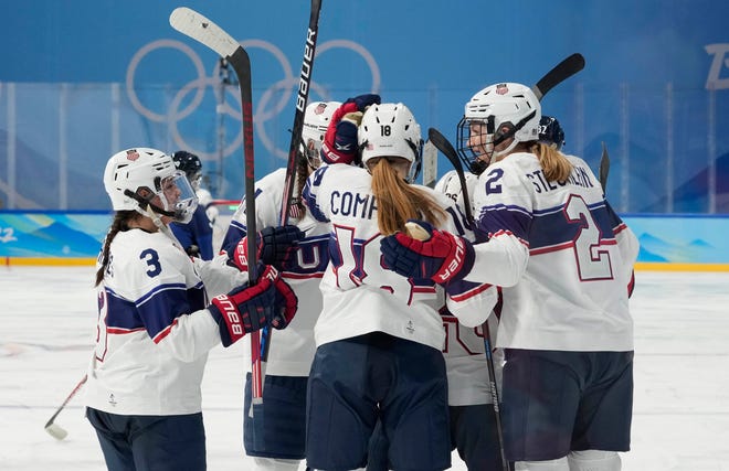 Team United States forward Kendall Coyne Schofield (26) celebrates with teammates after scoring a goal against Finland in the second period of a women's ice hockey Group A match during the Beijing 2022 Olympic Winter Games at Wukesong Sports Centre.