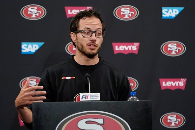 San Francisco 49ers offensive coordinator Mike McDaniel speaks during a news conference at training camp.