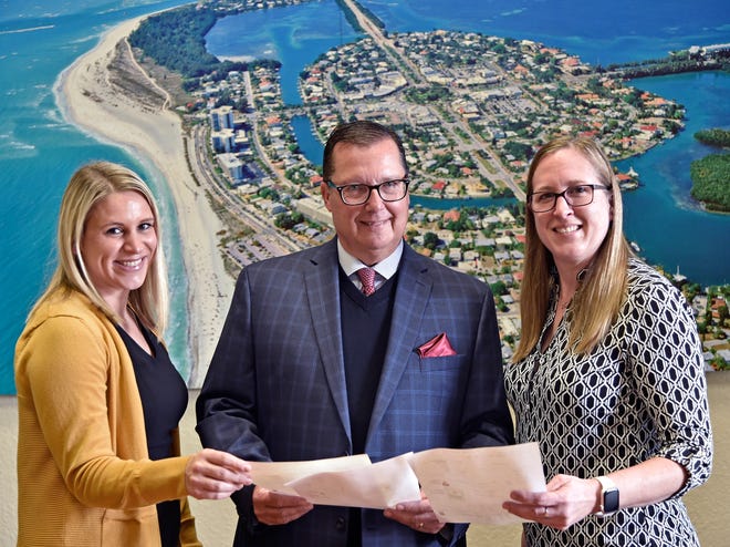 Katie Kohler, the research analyst with Scott Cietek, managing broker at the commercial real estate arm of Michael Saunders & Co, and Christina Gustafson, listing and closing coordinator MSC Commercial.