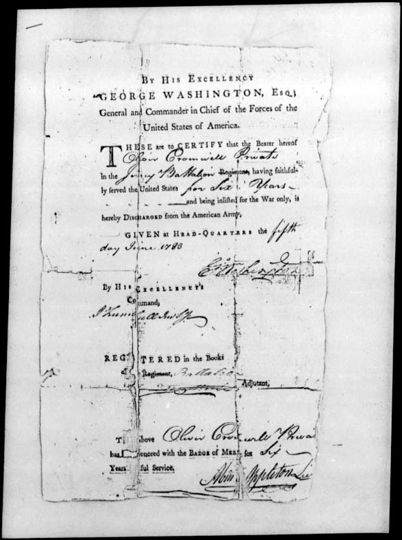 The 1853 discharge papers of Oliver Cromwell, on file at the Department of Veterans Affairs. The papers bear the signature of General Geroge Washington, and confer on Cromwell the Badge of Merit for six years faithful service.