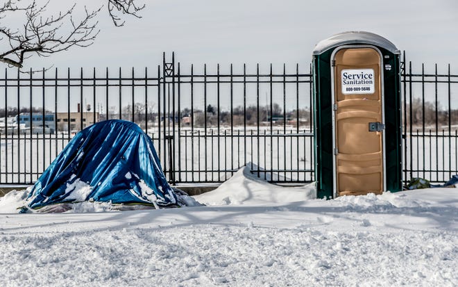 A homeless encampment is located along the White River on Friday, Feb. 4, 2022, in Indianapolis. 