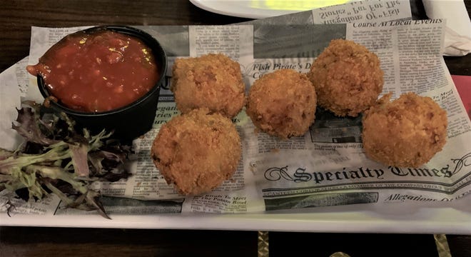The Stuffed Potato Tots at 2nd Street Bistro were deep-fried shredded potatoes stuffed with bacon and cheddar served with a beer-bacon-truffle ketchup.