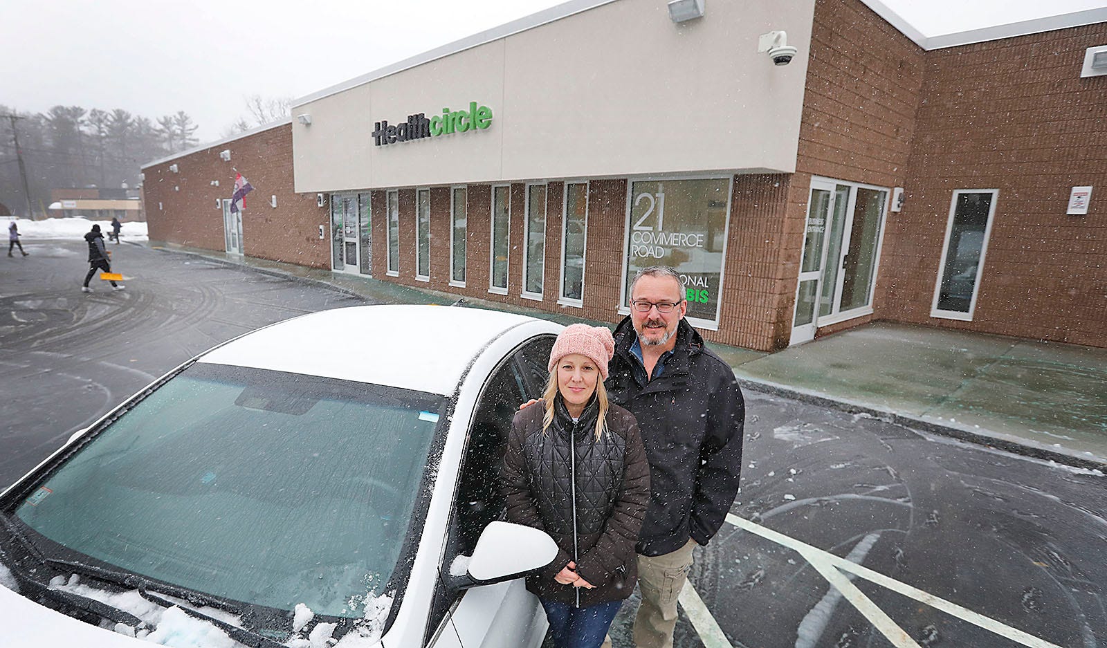 Rhonda and Roy LaFlamme, who own a cannabis home delivery business called Bracts and Pistil, in front of the Health Circle in Rockland on Friday, Feb. 4, 2022.
