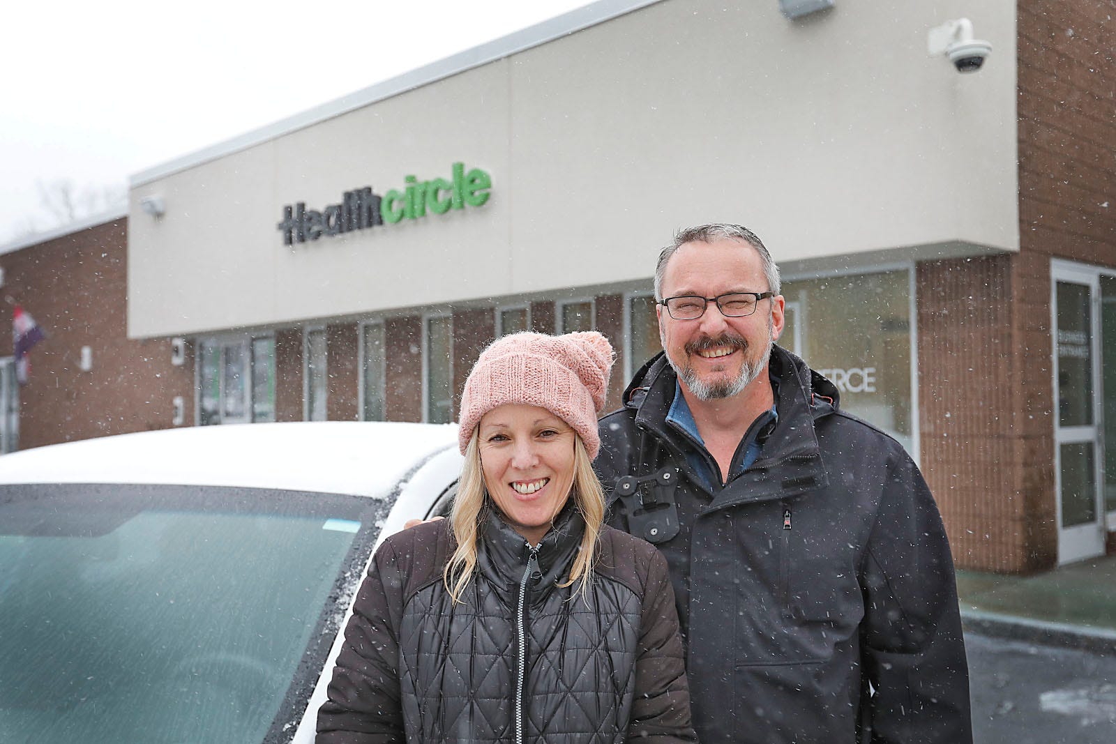 Rhonda and Roy LaFlamme, who own a cannabis home delivery business called Bracts and Pistil, in front of the Health Circle in Rockland on Friday, Feb. 4, 2022.