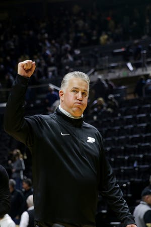 Purdue head coach Matt Painter motions to the crowd after Purdue defeated Michigan, 82-76, Saturday, Feb. 5, 2022 at Mackey Arena in West Lafayette.