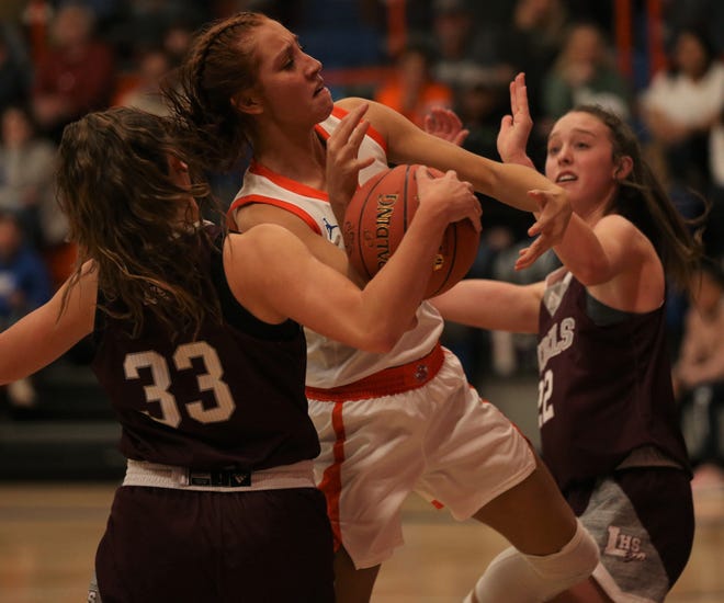 San Angelo Central High School's Deandra Allen, center, fights hard for a rebound during a District 2-6A basketball game against Midland Legacy at Babe Didrikson gym on Friday, Feb. 4, 2022.