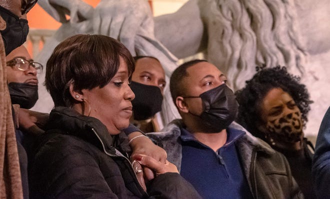 Karen Wells (L) and Andre Locke (R), parents of Amir Locke, look on during a press conference at City Hall in Minneapolis, Minnesota on February 4, 2022.