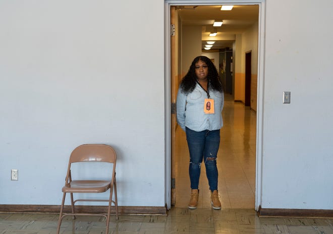Angeleila Watkins stands in the doorway on Feb. 5 at a warming center at Summit United Methodist Church in Columbus.
