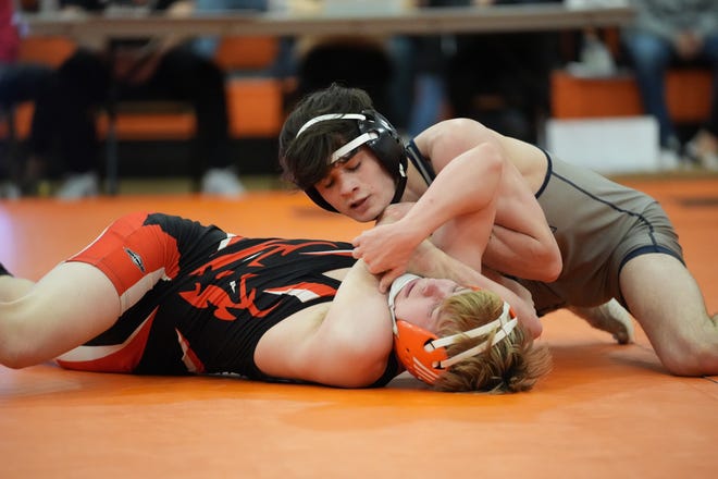 Notre Dame-West Burlington senior Blaine Frazier (top) pinned Washington's Jude Carter in 1:55 to win the title at 132 pounds.