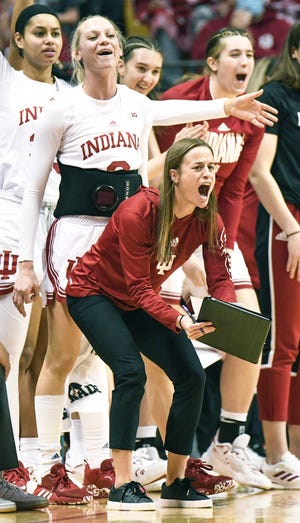 Indiana assistant coach Ashley Williams celebrates after a made basket during the game against Purdue at Simon Skjodt Assembly Hall Sunday afternoon.