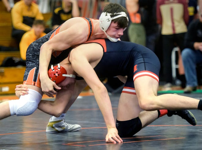 Washington's Blake Hinrichsen, top, grapples with Metamora's Syril Kiefner in the 160-pound division of the Class 2A wrestling regional final Saturday, Feb. 5, 2022 at Washington Community High School. Hinrichsen defeated Kiefner in a 19-3 in a technical fall.